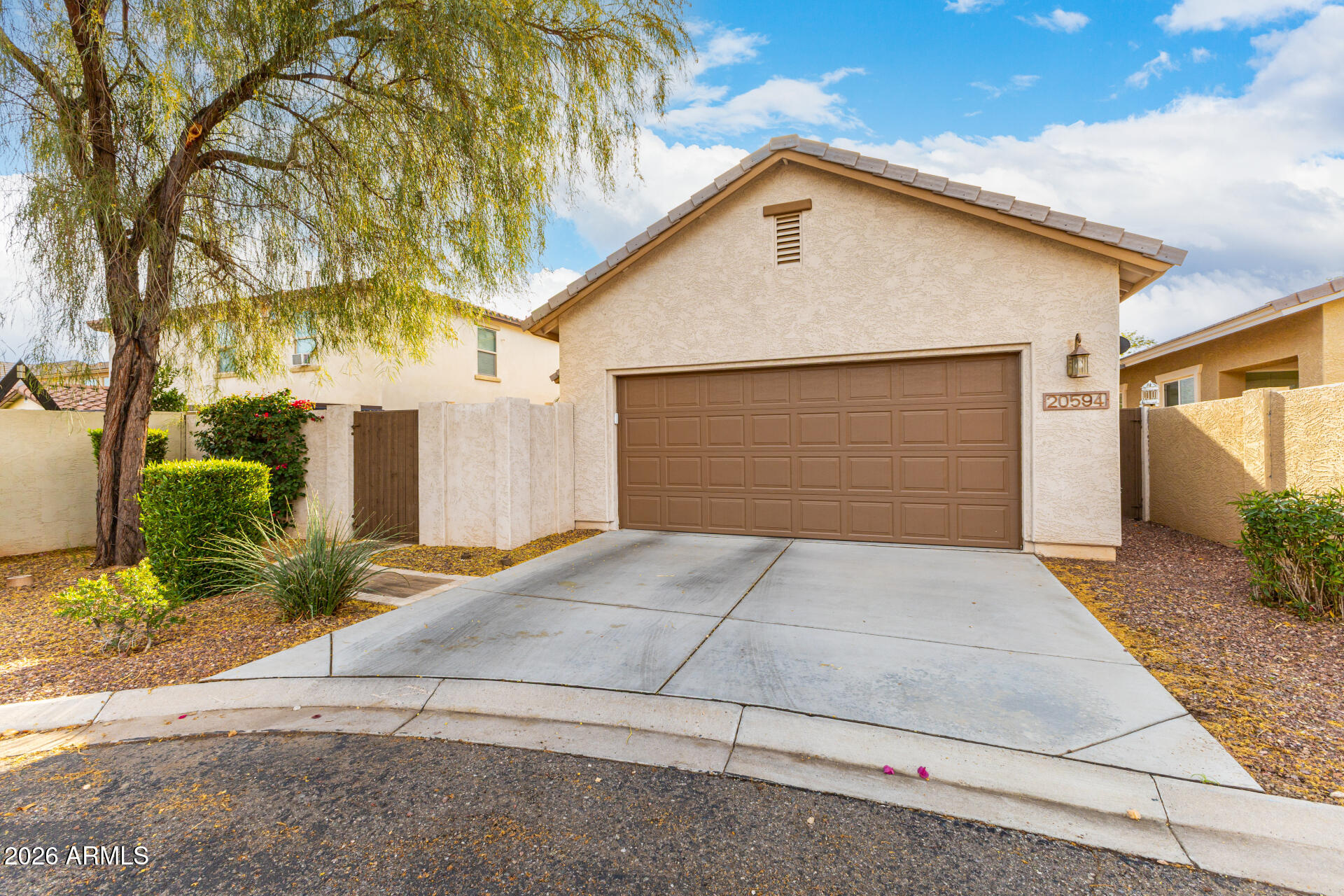 20594 West White Rock Road Buckeye, AZ 85396 - Photo 29 of 38 a front view of house with garage and yard