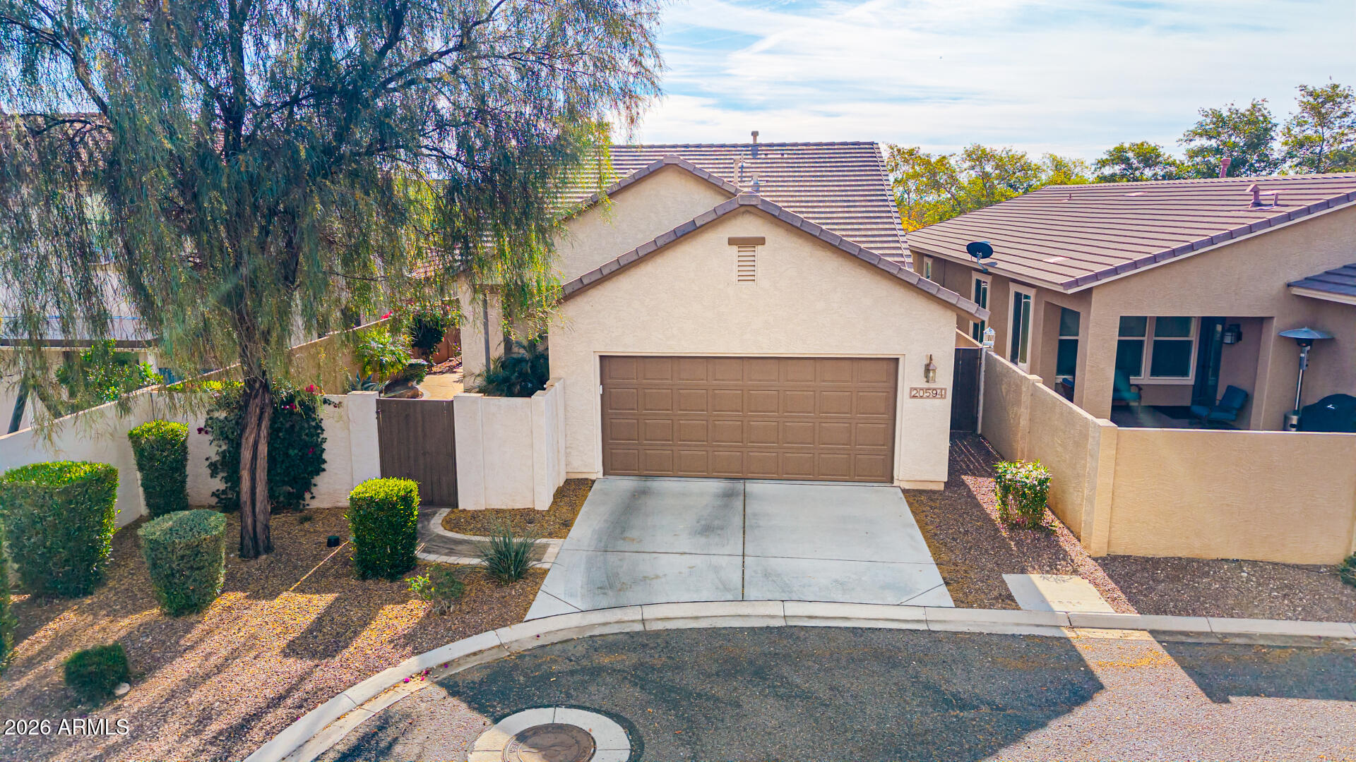 20594 West White Rock Road Buckeye, AZ 85396 - Photo 30 of 38 a front view of a house with garden