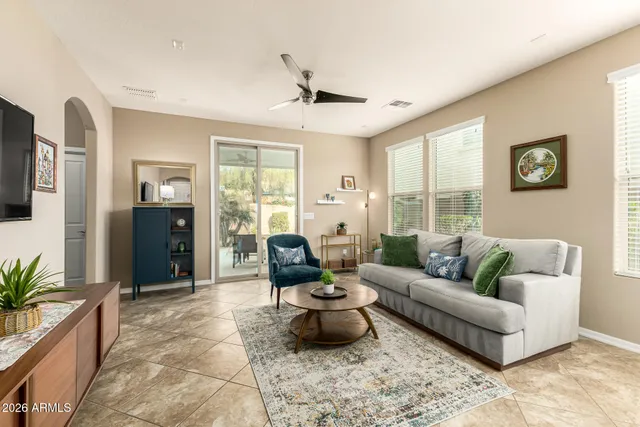 a living room with furniture and a large window