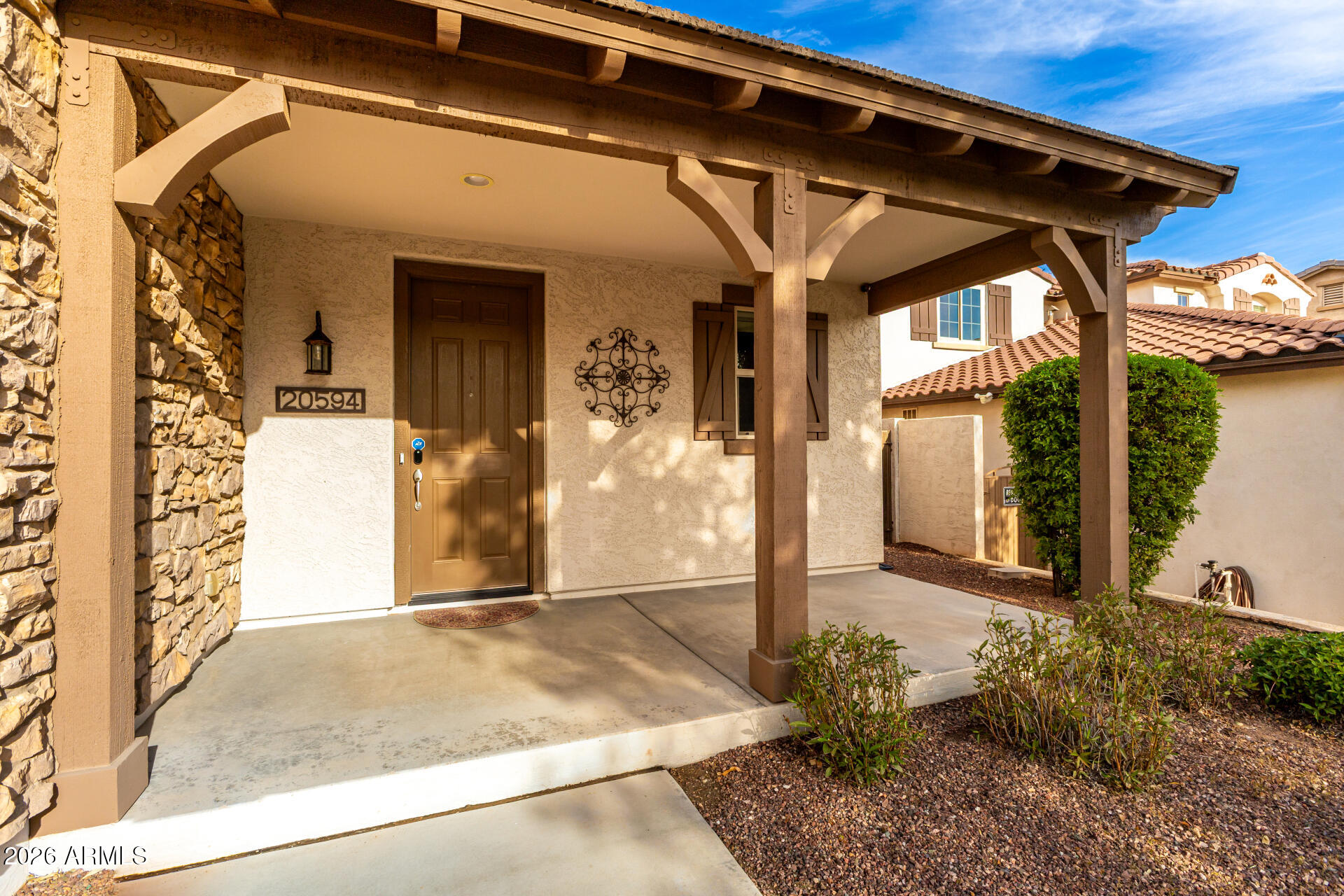 20594 West White Rock Road Buckeye, AZ 85396 - Photo 38 of 38 a view of a front door and outdoor space