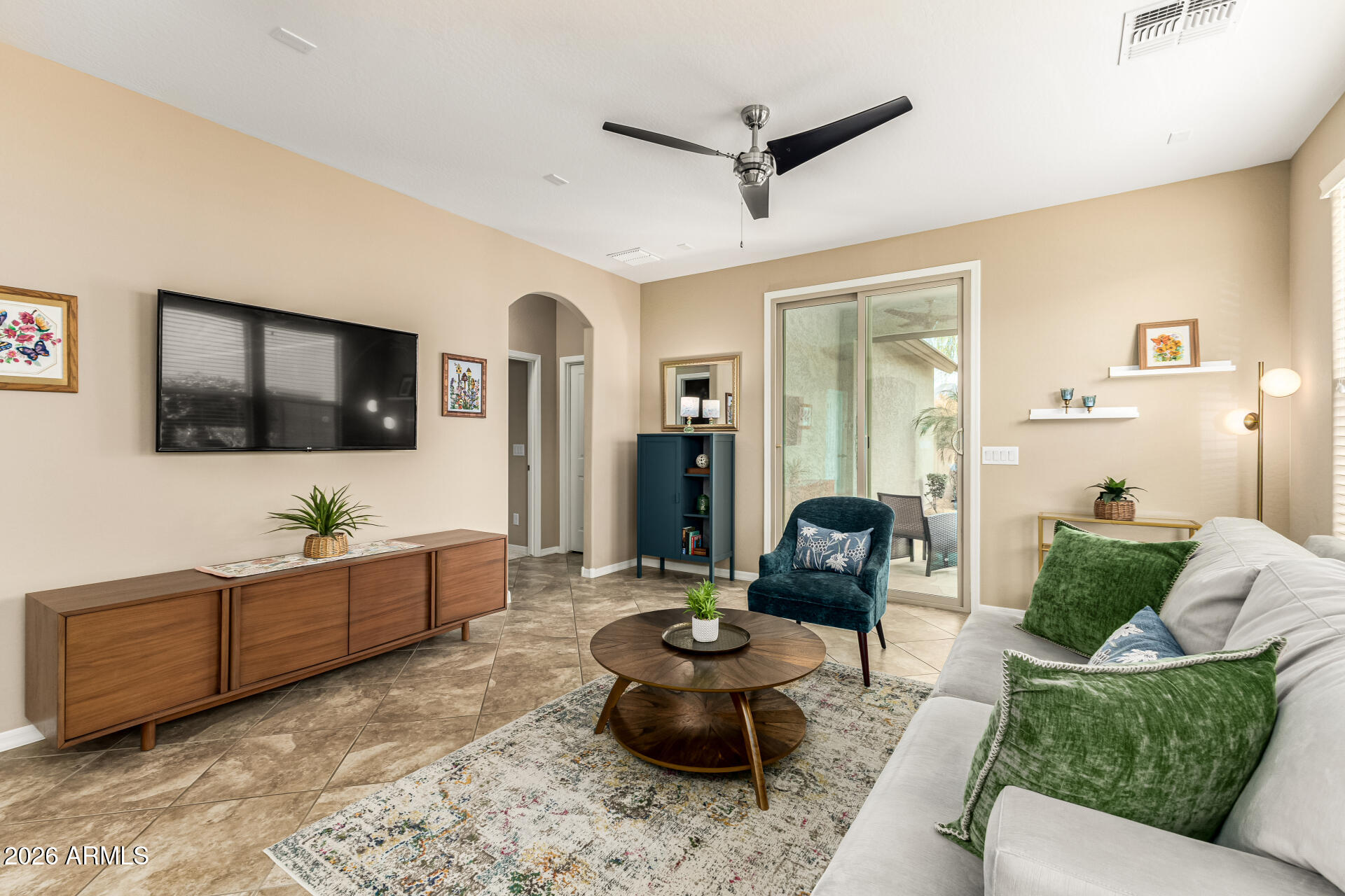 20594 West White Rock Road Buckeye, AZ 85396 - Photo 4 of 38 a living room with furniture and a flat screen tv