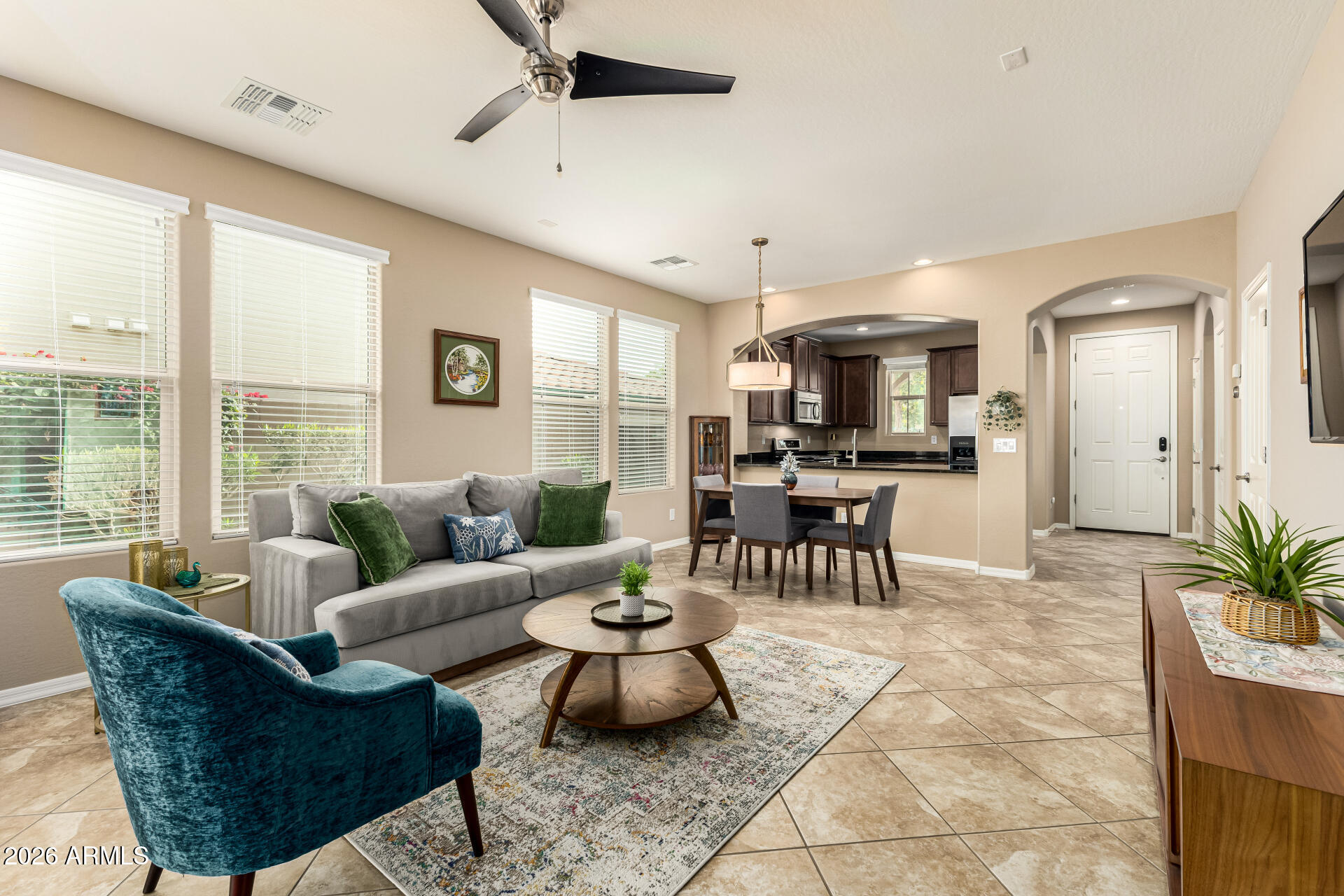 20594 West White Rock Road Buckeye, AZ 85396 - Photo 5 of 38 a living room with furniture and a large window