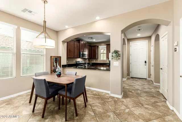 a dining room with furniture and window