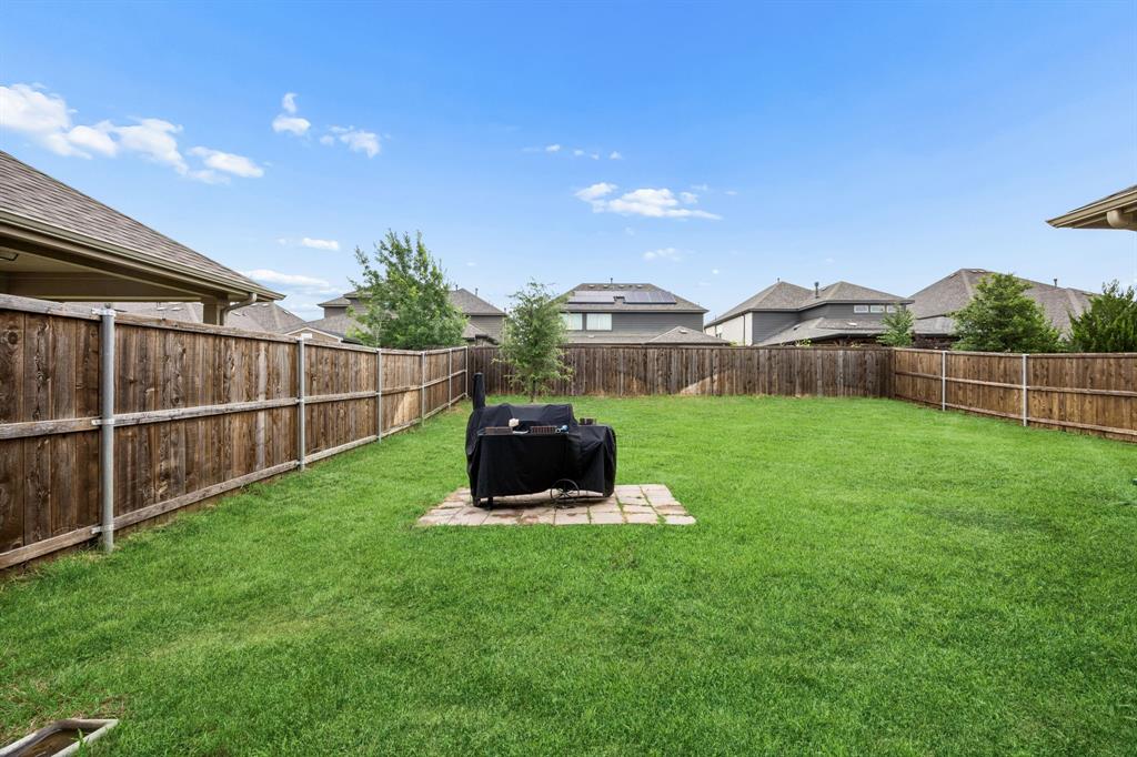 11732 Wulstone Road Fort Worth, TX 76052 - Photo 20 of 34 Expansive green lawn with complete wood fencing