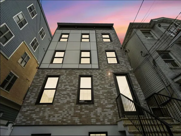 a bathroom with a toilet sink and shower