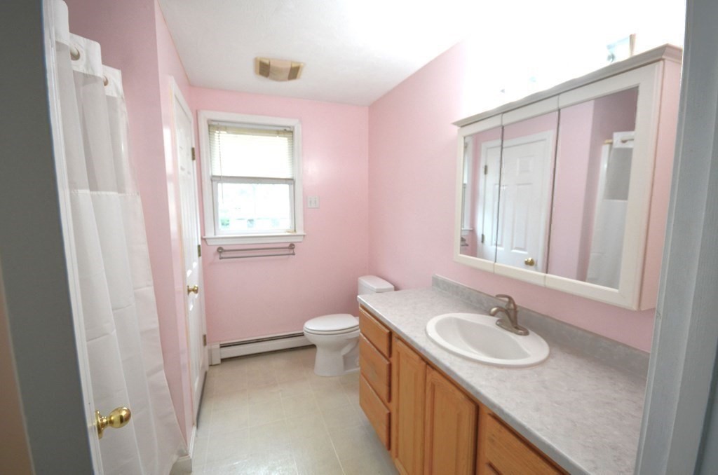 12 Leon Road Holbrook, MA 02343 - Photo 12 of 23 a bathroom with a granite countertop sink and a mirror