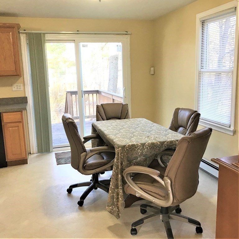 12 Leon Road Holbrook, MA 02343 - Photo 5 of 23 a view of a dining room with a table and chairs