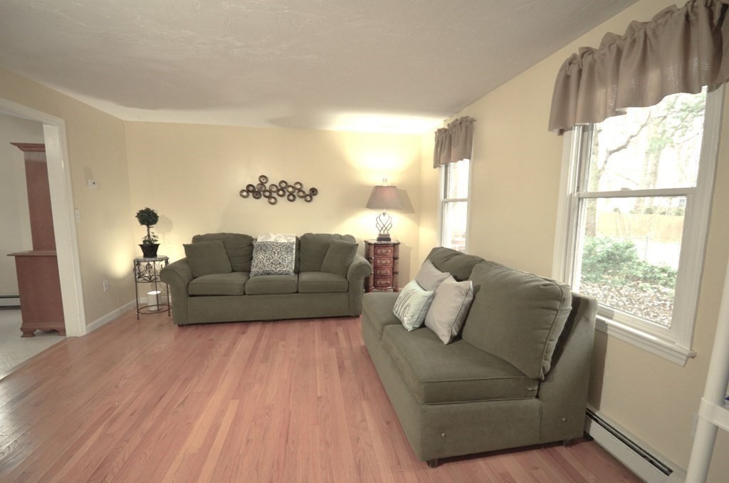 12 Leon Road Holbrook, MA 02343 - Photo 7 of 23 a living room with furniture and a large window