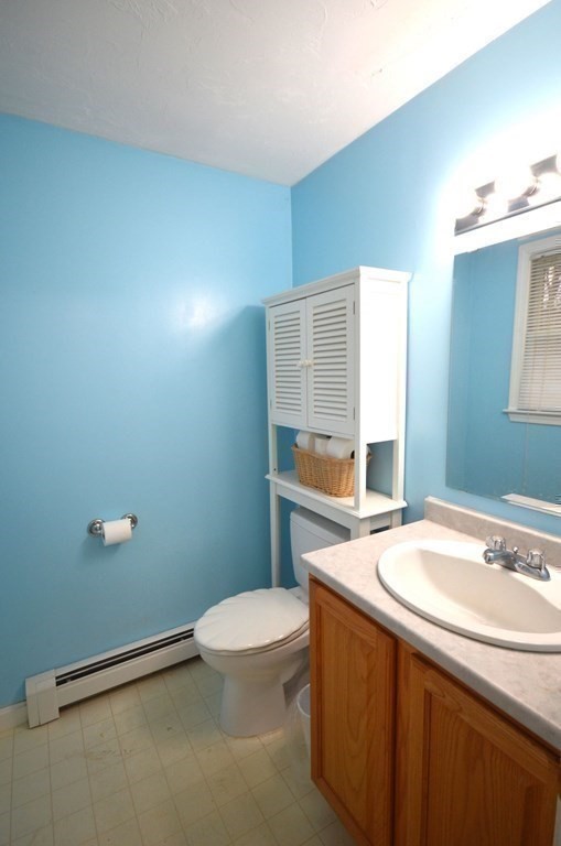 12 Leon Road Holbrook, MA 02343 - Photo 9 of 23 a bathroom with a sink a toilet and a mirror