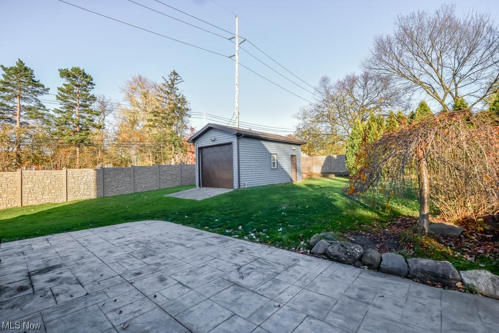 15381 Ridge Road North Royalton, OH 44133 - Photo 24 of 29 View of yard featuring a patio and a garage