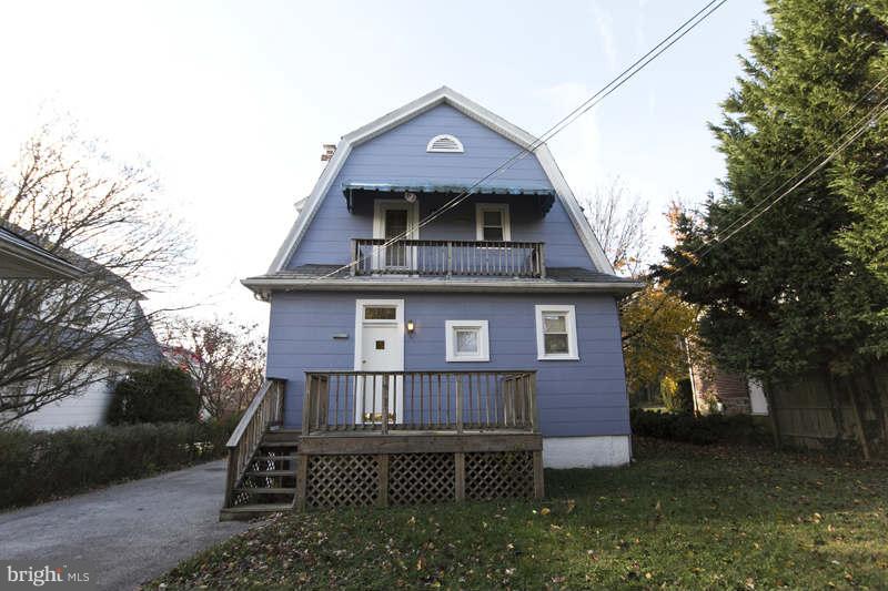 509 Kingston Road Baltimore, MD 21229 - Photo 2 of 17 a front view of a house with a yard