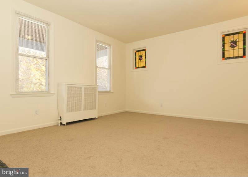 509 Kingston Road Baltimore, MD 21229 - Photo 4 of 17 an empty room with windows