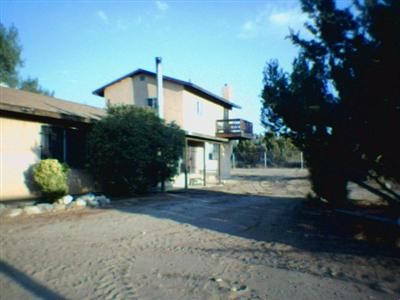 10363 Silver Rock Road Pinon Hills, CA 92372 - Photo 1 of 1 a view of a house with a yard