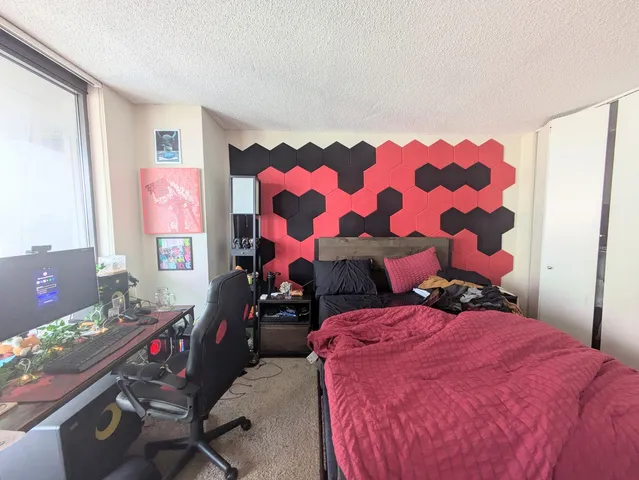 a bedroom with a bed and a couch