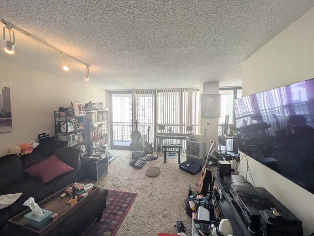 a living room with furniture and a large window