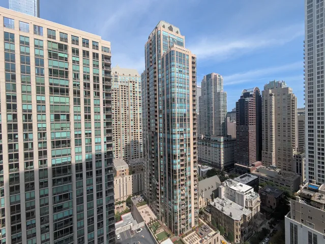 a view of a city with tall buildings