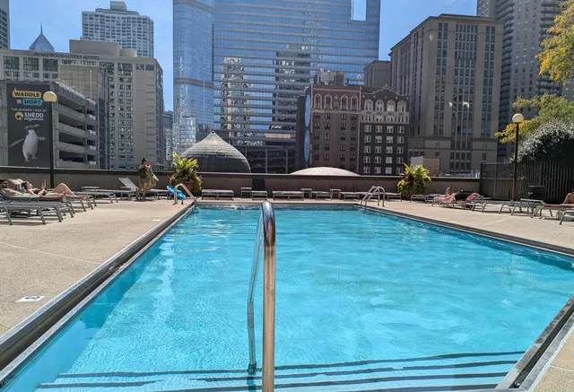 a view of a patio with a table and chairs