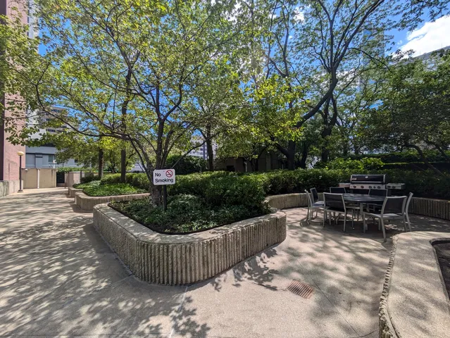 a view of a patio with a chairs and table in a patio