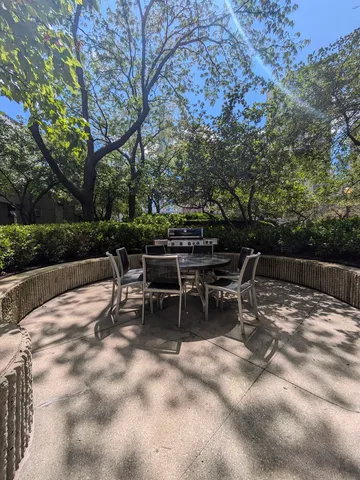 a view of backyard with sitting area