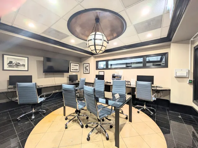 a outdoor space with lots of furniture and white walls