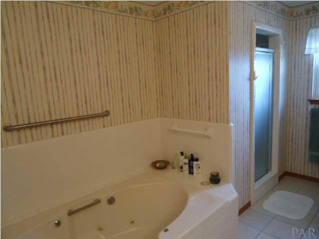 7840 Petersen Point Road Milton, FL 32583 - Photo 10 of 24 Their is a urinal for the men.