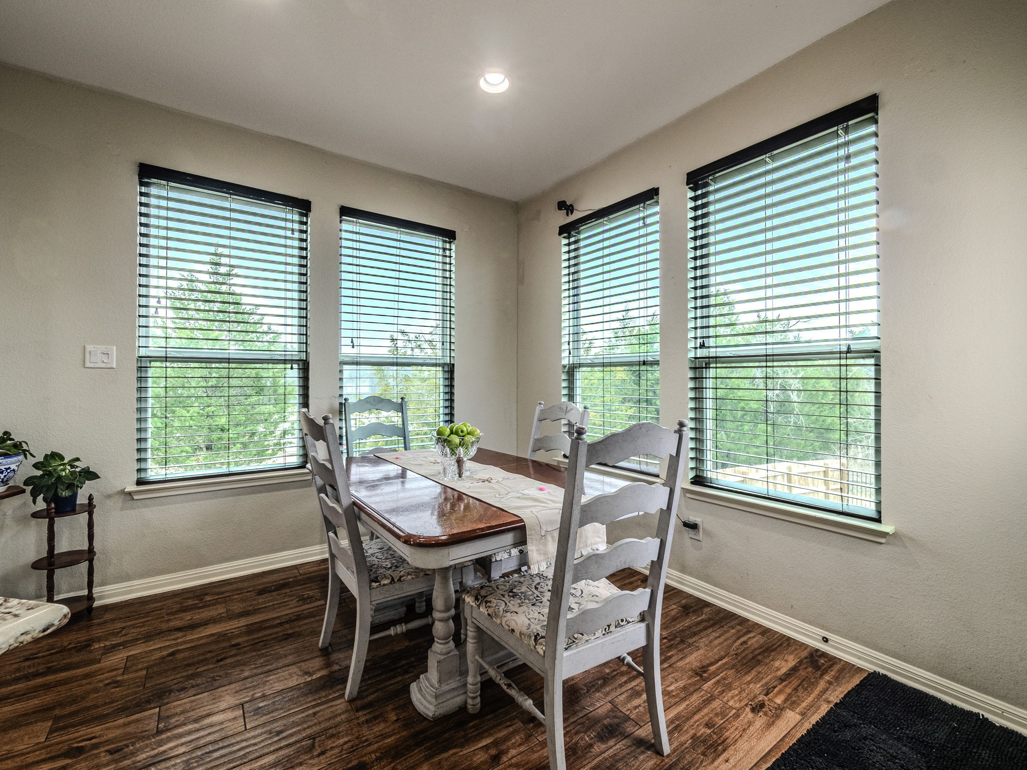 117 Arbor Point Drive Elgin, TX 78621 - Photo 12 of 40 Dining area featuring dark wood-style flooring and a textured wall