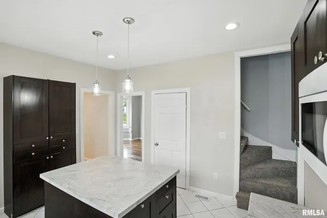 a view of a kitchen cabinets and wooden floor