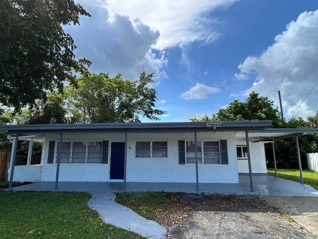 5724 Seton Drive Margate, FL 33063 - Photo 1 of 12 front view of a house with a yard