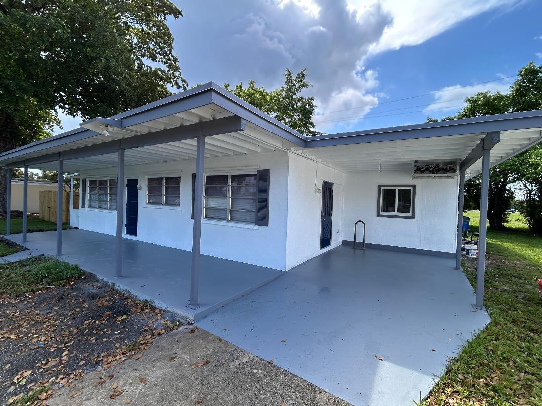 5724 Seton Drive Margate, FL 33063 - Photo 3 of 12 a view of a house with a garage