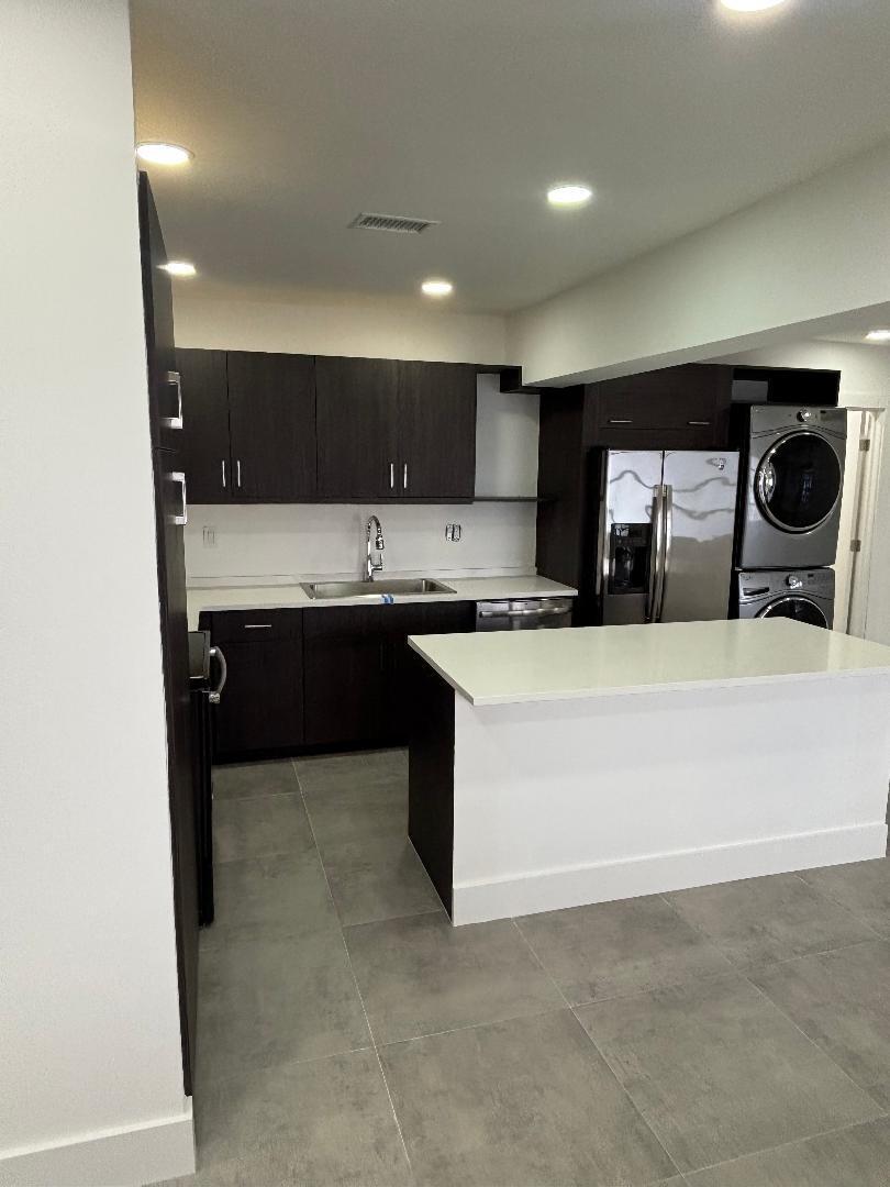 5724 Seton Drive Margate, FL 33063 - Photo 4 of 12 a kitchen with a sink and cabinets
