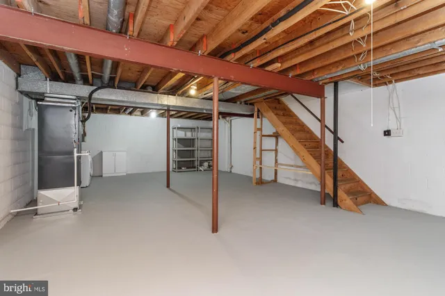 a view of an empty room with white walls