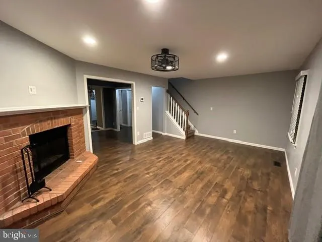 a view of an empty room and fire place