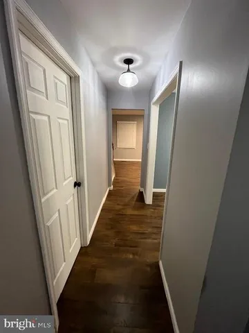 a view of a hallway view with staircase