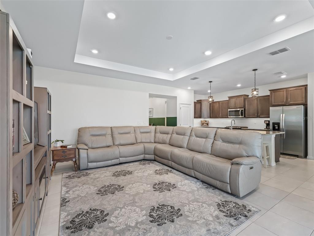 7206 Southwest 60th Lane Ocala, FL 34474 - Photo 18 of 50 a living room with furniture and kitchen view