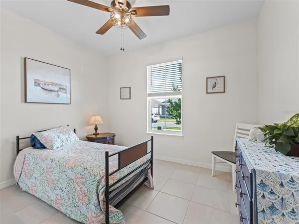 a bedroom with a bed and a table in it