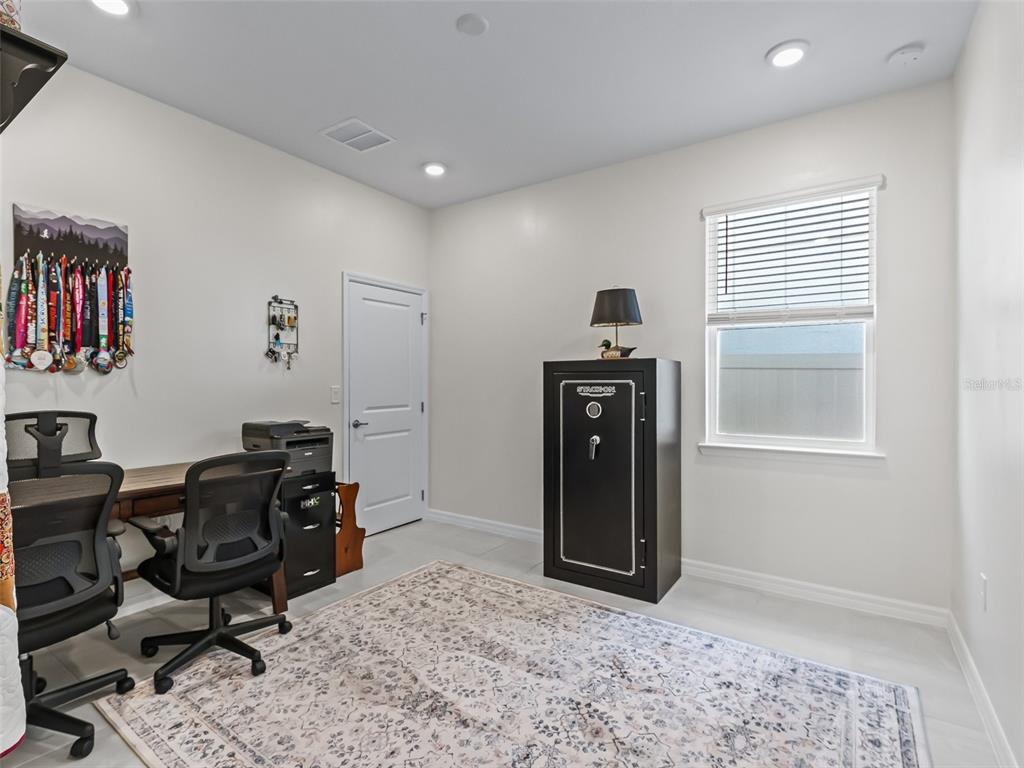 7206 Southwest 60th Lane Ocala, FL 34474 - Photo 32 of 50 a view of a workspace with furniture and a window