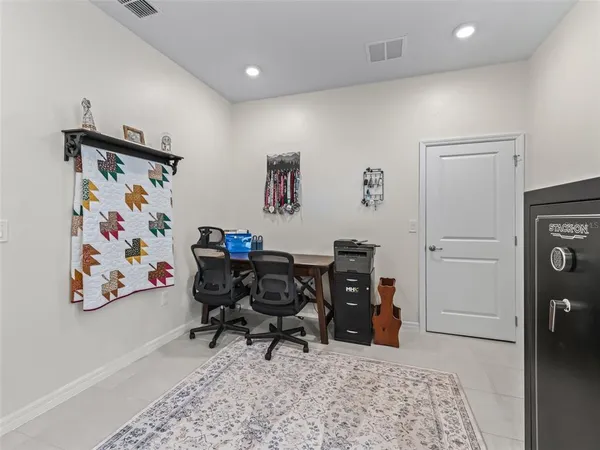 a view of a workspace with furniture