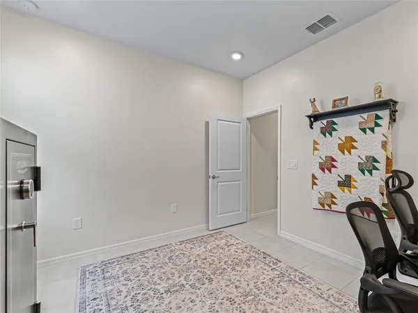 a view of a hallway with workspace and entryway