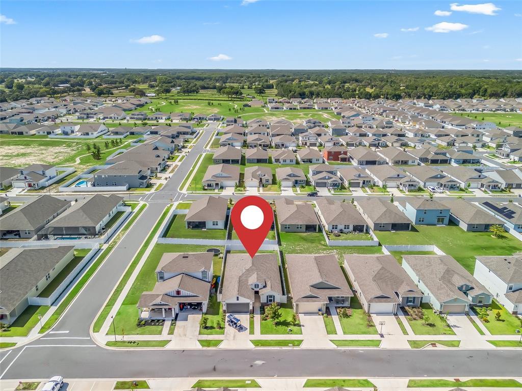 7206 Southwest 60th Lane Ocala, FL 34474 - Photo 45 of 50 an aerial view of residential houses with outdoor space and swimming pool