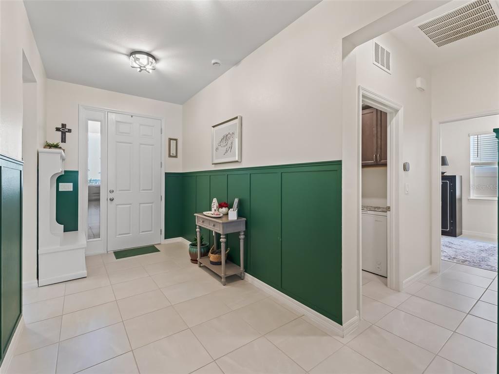 7206 Southwest 60th Lane Ocala, FL 34474 - Photo 6 of 50 a view of a elevator and a livingroom with wooden floor