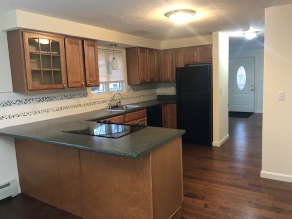 60 Cushing Road Webster, MA 01570 - Photo 12 of 30 a kitchen with stainless steel appliances granite countertop a sink and a refrigerator