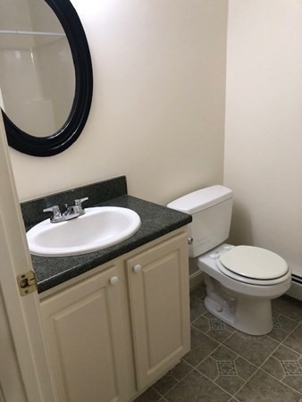 60 Cushing Road Webster, MA 01570 - Photo 21 of 30 a bathroom with a sink and a mirror