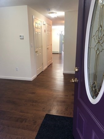 60 Cushing Road Webster, MA 01570 - Photo 3 of 30 a view of a hallway with wooden floor