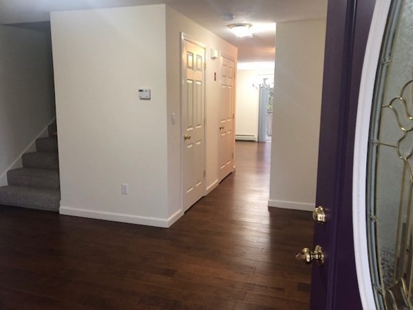 60 Cushing Road Webster, MA 01570 - Photo 4 of 30 a view of a hallway with wooden floor