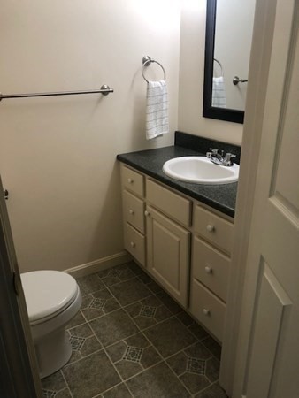 60 Cushing Road Webster, MA 01570 - Photo 7 of 30 a bathroom with a sink a toilet and mirror