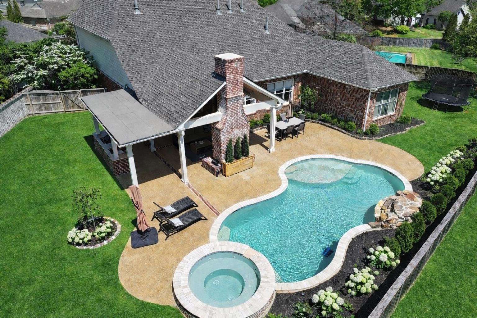 10257 Old Course Cove Collierville, TN 38017 - Photo 1 of 38 an aerial view of a house with garden space and outdoor seating