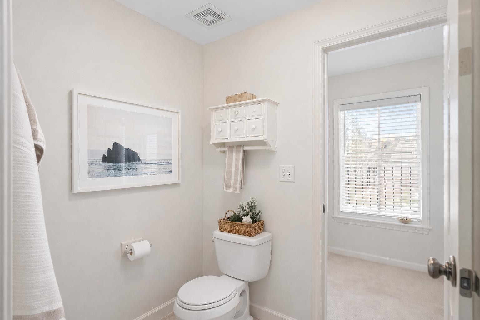 10257 Old Course Cove Collierville, TN 38017 - Photo 31 of 38 a bathroom with a toilet a sink and a window