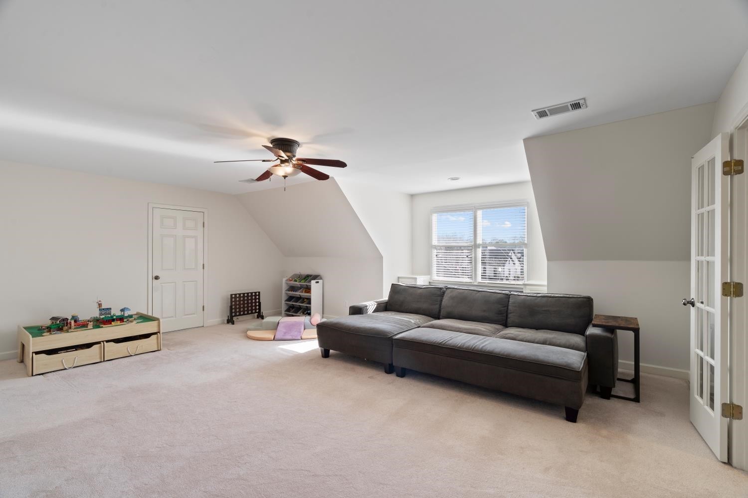 10257 Old Course Cove Collierville, TN 38017 - Photo 36 of 38 a living room with furniture and a ceiling fan
