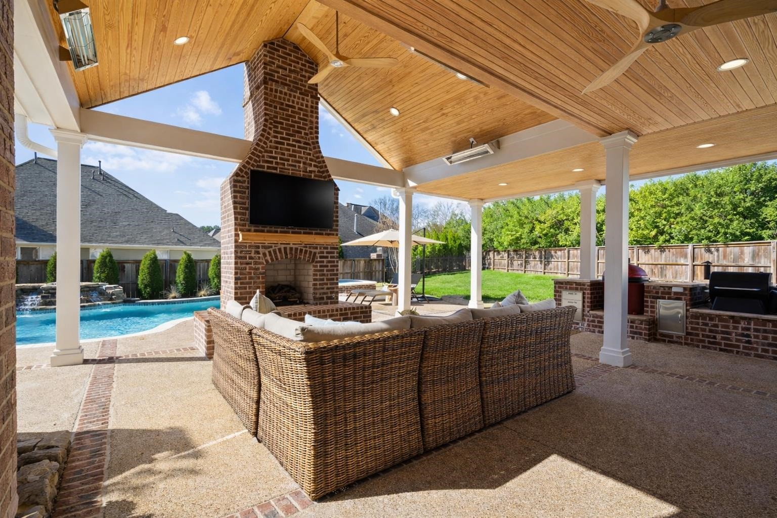 10257 Old Course Cove Collierville, TN 38017 - Photo 4 of 38 a living room with patio fireplace furniture and a garden