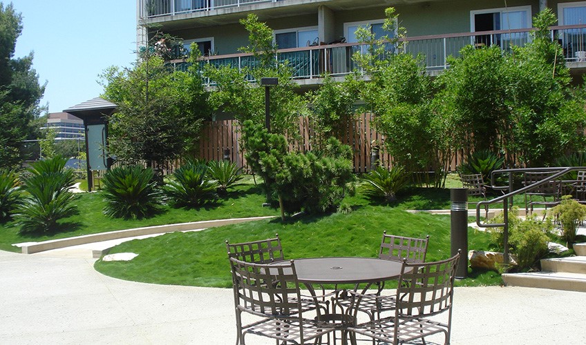 450 South Grand View Street Los Angeles, CA 90057 - Photo 3 of 9 a view of a chairs and table in backyard